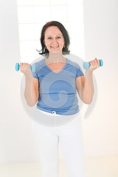 Woman with dumbbell