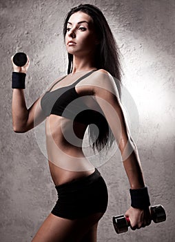 Woman with dumbbells