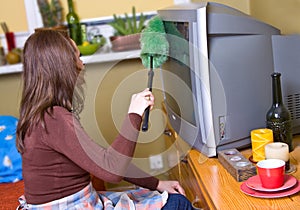 Woman is dusting