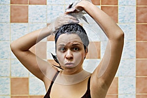 Woman dyeing hairs photo