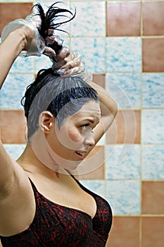 Woman dyeing hairs photo