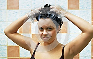 Woman dyeing hairs photo