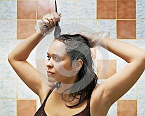 Woman dyeing hairs photo