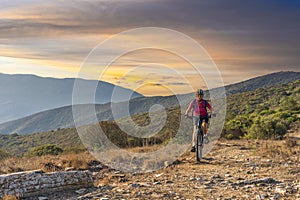 Woman with e bike on Elba Island, Italy