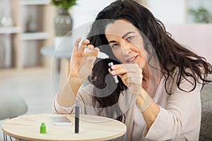 woman with e-cigarette and bottle liquid