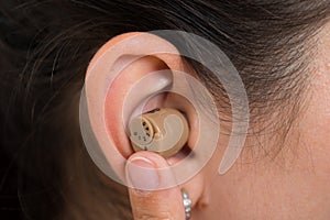 Woman Ear With Hearing Aid