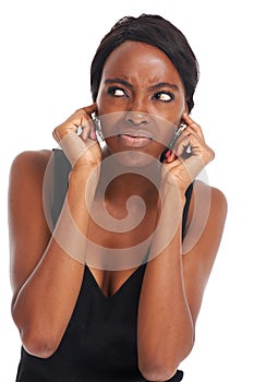 Woman, ears and studio annoyed or noise listening, tired or frustrated frown. Black model person, confused face and
