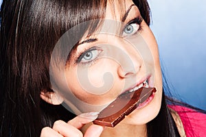 Woman eat chocolate bar