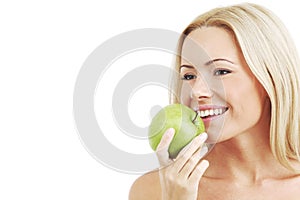 Woman eat green apple