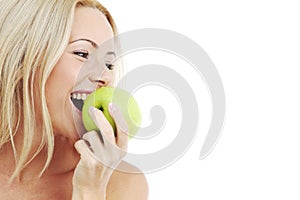 Woman eat green apple