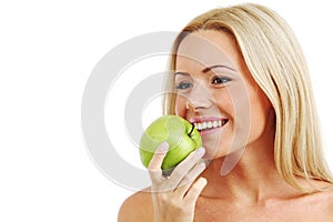 Woman eat green apple