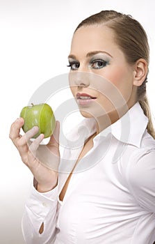 Woman eat green apple