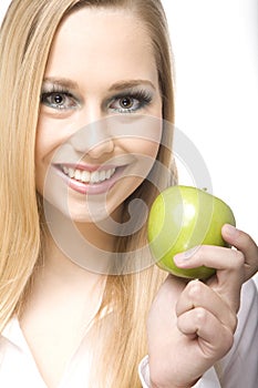 Woman eat green apple