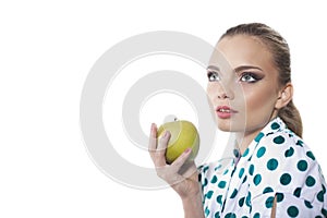 Woman eat green apple