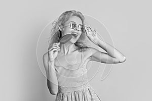 woman eat icecream in studio. woman with icecream on background. woman with icecream at summer. woman with icecream