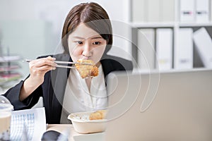 Woman eat lunch and work