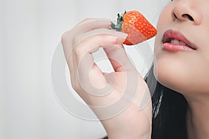 Woman eat strawberry red berry fruit sweet juicy
