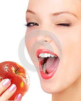 Woman eating apple.