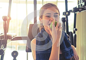 Woman is eating apple, for healthy sport fitness concept