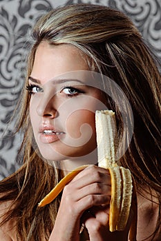 Woman eating banana