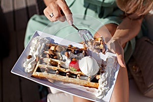 Woman eating belgium img