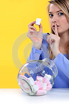 Woman eating bonbons