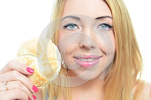 Woman eating bread roll