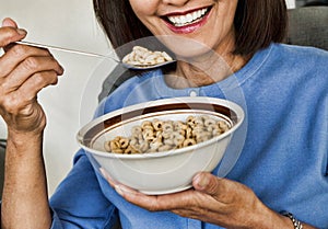 Woman Eating Breakfast Cereal