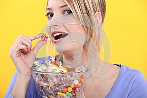 Woman eating candy