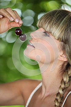 Woman eating cherries