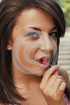 woman eating cherry