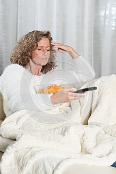 Woman eating chips and zapping