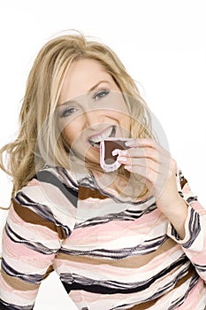 Woman eating chocolate