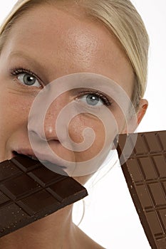 Woman eating a chocolate bar