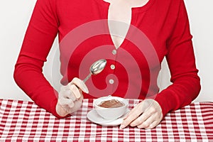 Woman eating chocolate pudding