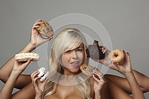 Woman eating cream cakes