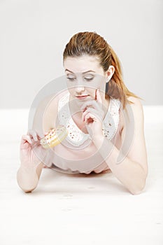 Woman eating a doughnut