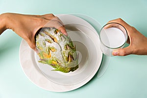 Woman eating durian shaped fruit bread