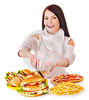 Woman eating fast food.