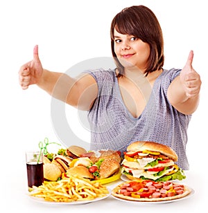 Woman eating fast food.