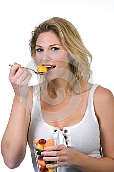 Woman eating fruit