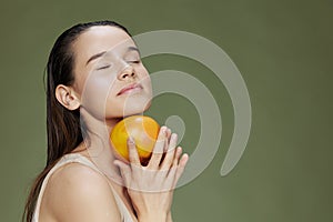 woman eating grapefruit in hands smile vitamins diet close-up Lifestyle