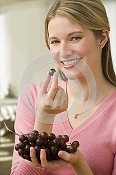 Woman Eating Grapes