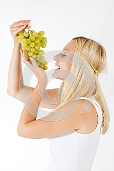 Woman eating grapes