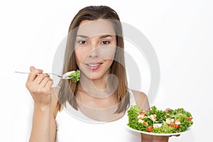 Woman eating healthy food, Caesar salad