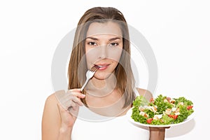 Woman eating healthy food, Caesar salad