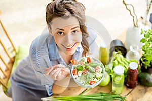 Woman eating healthy salad