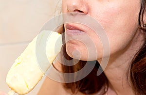 Woman eating ice cream, close up