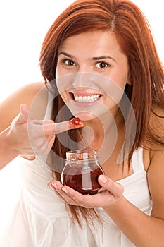 Woman eating jam photo