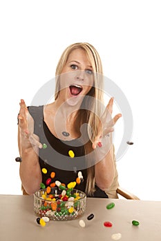 Woman eating jelly beans and throwing them
